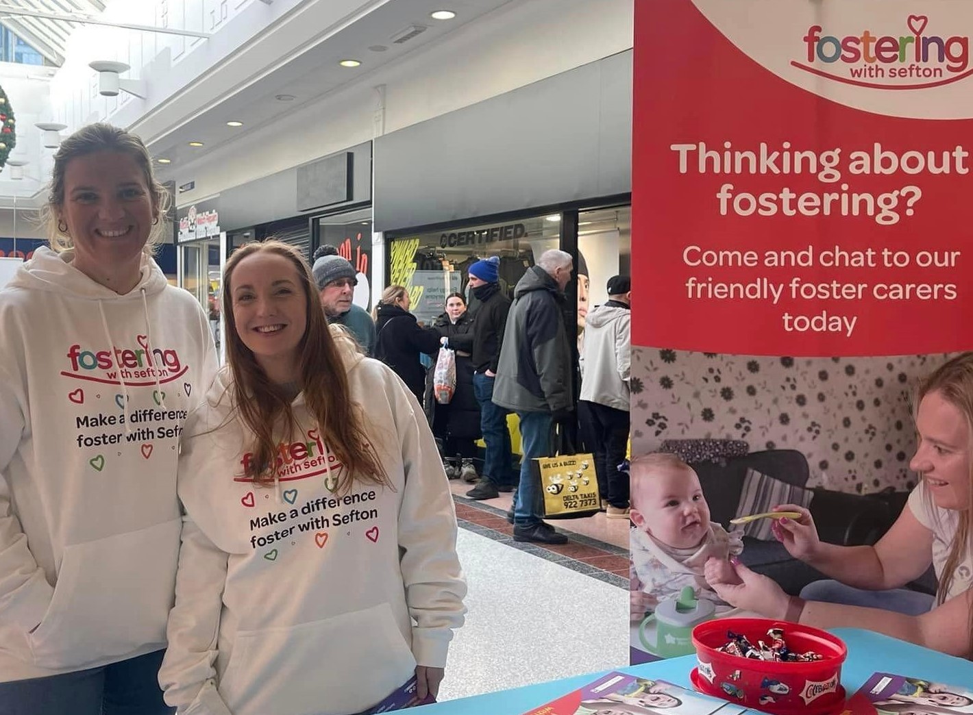 Sefton foster carers greeting people at the Strand