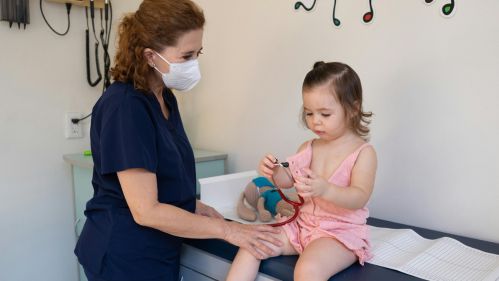 young girl with medical professional