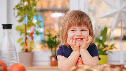 girl sitting with chin in hands