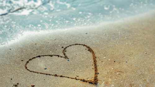 heart drawn in sand