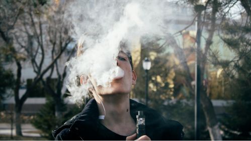 Young man vaping
