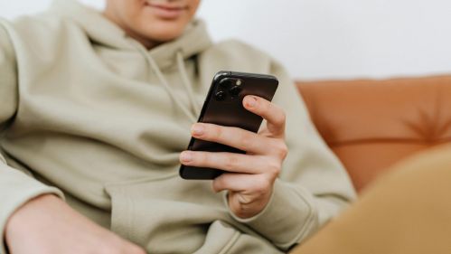 young man scrolling on his smartphone